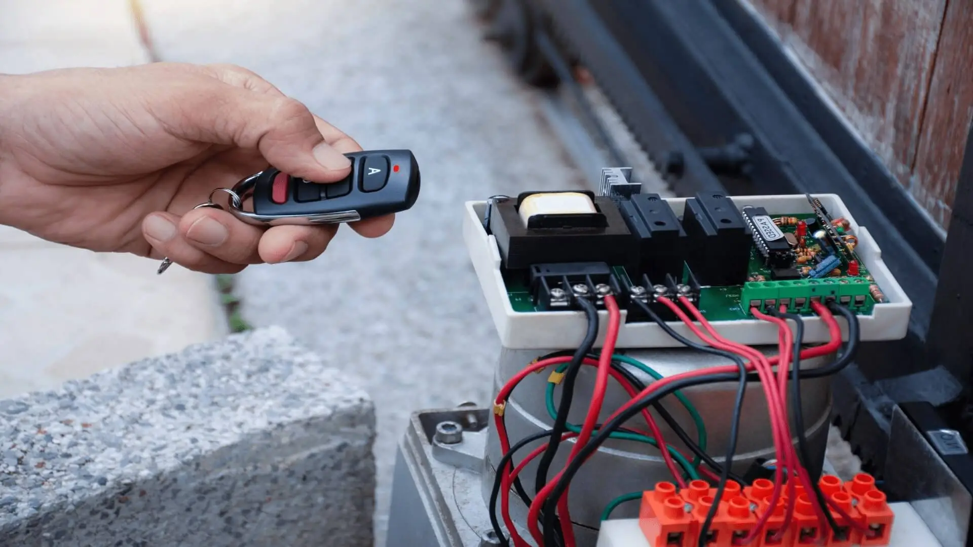 Technician programming a gate operator control board