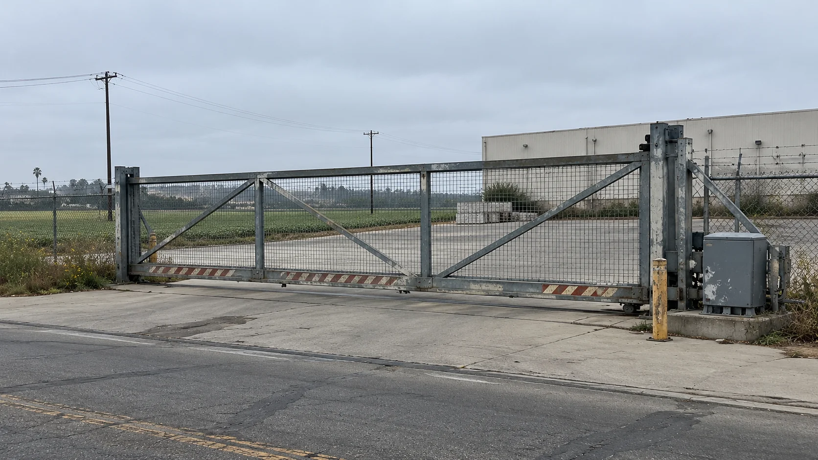 Royal Gate Services technician servicing a commercial sliding gate in Oxnard